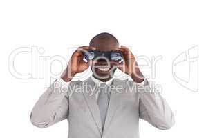 Businessman happy Looking through binoculars