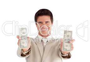 Businessman holding dollars in his hands