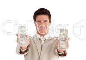 Businessman holding dollars in his hands