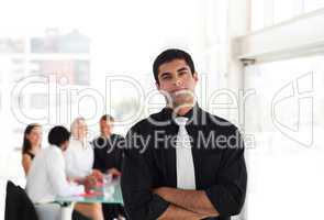 Serious Looking Businessman with arms Folded