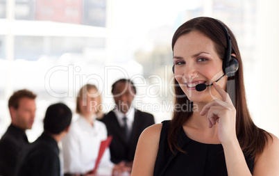 Young attractive woman talking on a headset