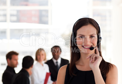 Young attractive woman talking on a headset