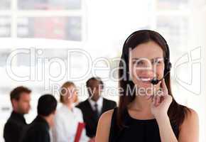 Young attractive woman talking on a headset