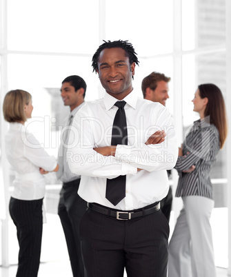 Potrait of a Businessman standing in front of team