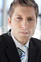 Young Attractive businessman looking at camera