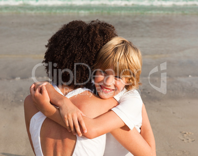 Young boy hugging his mother