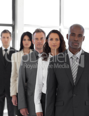 Serious business leader in front of business tea