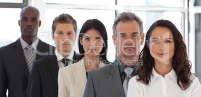 Multi Ethnic Business group looking at Camera