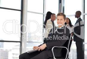 Businesss man in office sitting on chair