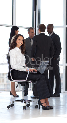 Young attractive woman in office working