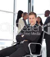 Businesss man in office sitting on chair