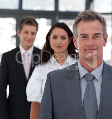 Senior Business man in Front of team