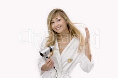 young blonde woman with hairdryer