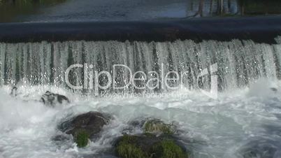 Dam and waterfall in river