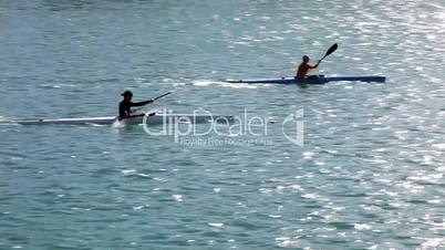 Man Padlling in canoe