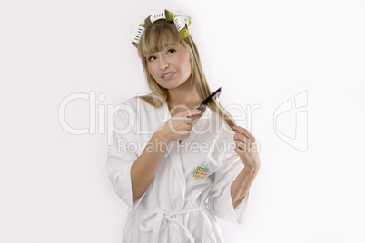 blond woman combs her hair