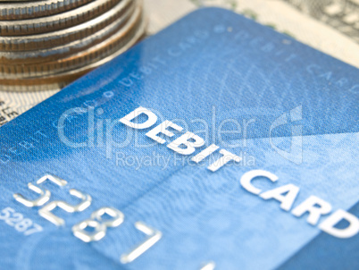 Narrow focus of debit card with money