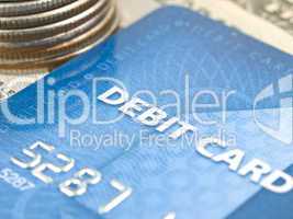 Narrow focus of debit card with money