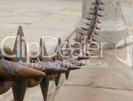 Close up of rusted spiked iron railings