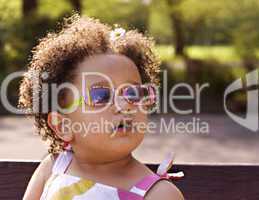 Young black baby girl with glasses