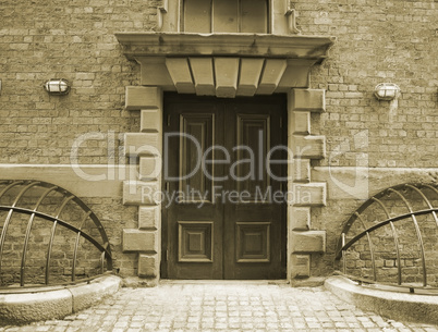 Entrance door with ornate stonework in a very old building (1824)