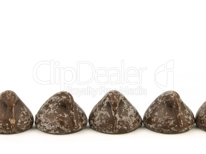 Chocolate chips on white background