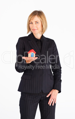 Businesswoman presenting model of house