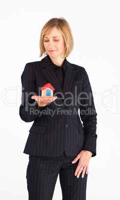 Senior businesswoman offering house