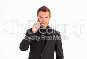 Handsome businessman talking on the phone