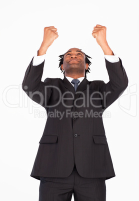 Businessman with raised arms looking upwards