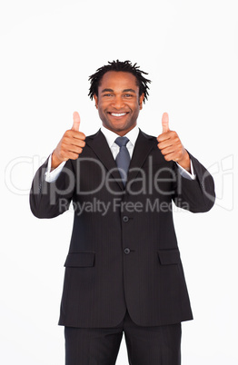 Smiling businessman with thumbs up