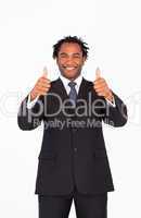 Smiling businessman with thumbs up