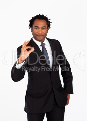 Serious  businessman showing okay sign
