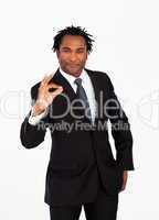 Serious  businessman showing okay sign