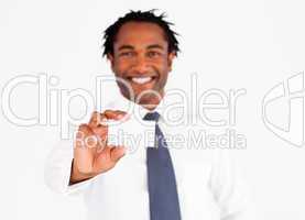 Afro-american businessman showing his card, focus on fingers and card