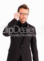 Young businessman with glasses looking at the camera