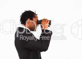 Sidewise closeup of businessman with binoculars