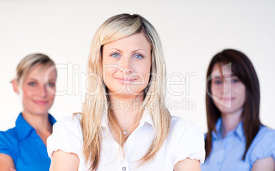 Three beautiful businesswomen smiling at the camera
