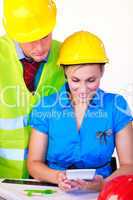 Female and male with hard hat working