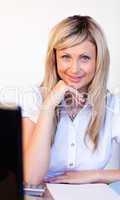 Confident businesswoman using a laptop