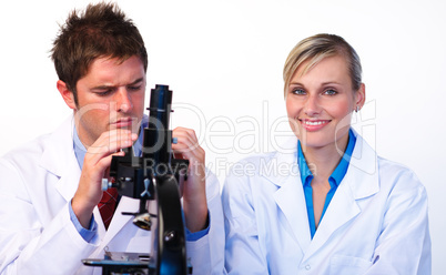 Science students looking through a microscope