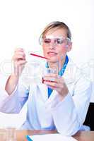 Female scientist examining a test-tube