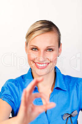 Smiling woman showing okay sign