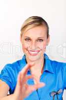 Smiling woman showing okay sign