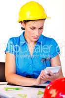 Young woman with hard hat focussing