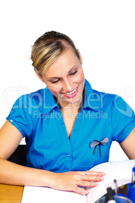 Blonde businesswoman reading reports in office