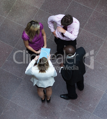 High angle of business people talking in office