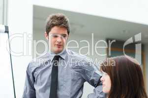 Young businessman speaking in a presentation