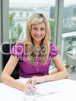 Portrait of a blonde businesswoman smiling at the camera