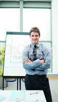 Smiling young businessman in office